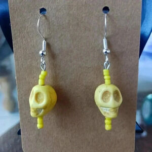 Set of really cool skulls earrings NWT...925 silver
